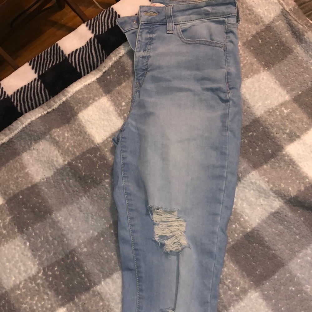 Light jeans with ripped knees